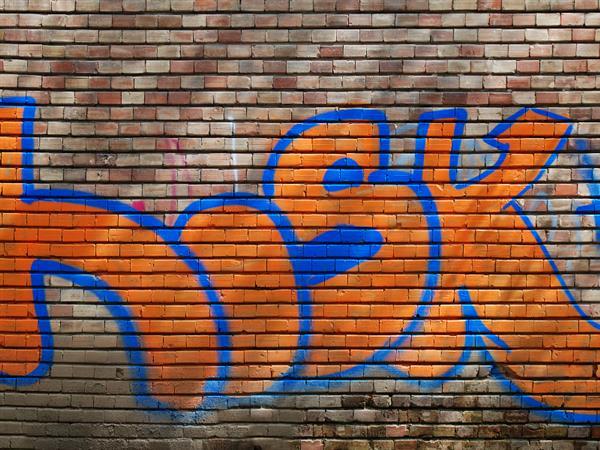 Orange bricks wall with graffiti texture