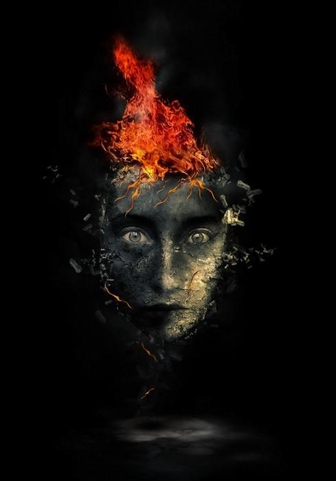 Surreal human face with flame hair and disintegration effect in Photoshop