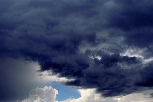 Dark Clouds And Blue Sky Background